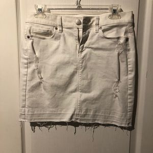 Distressed white jean skirt